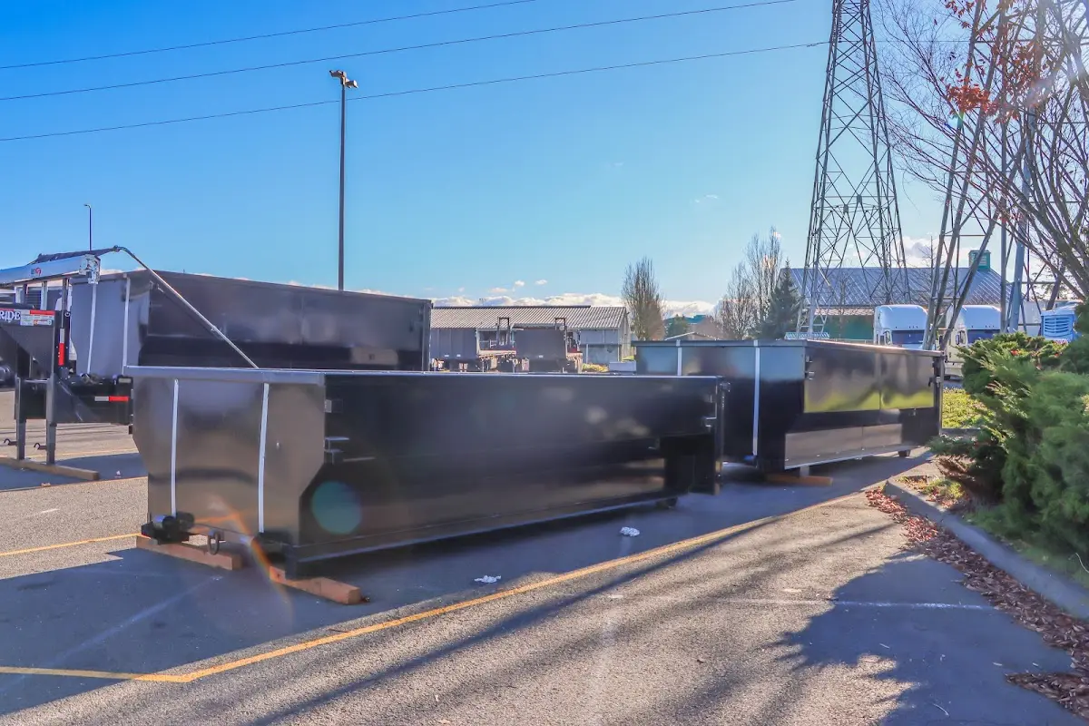 Roll-off dumpster ready for waste disposal at job site for Concrete Dumpster Rental in Moreau